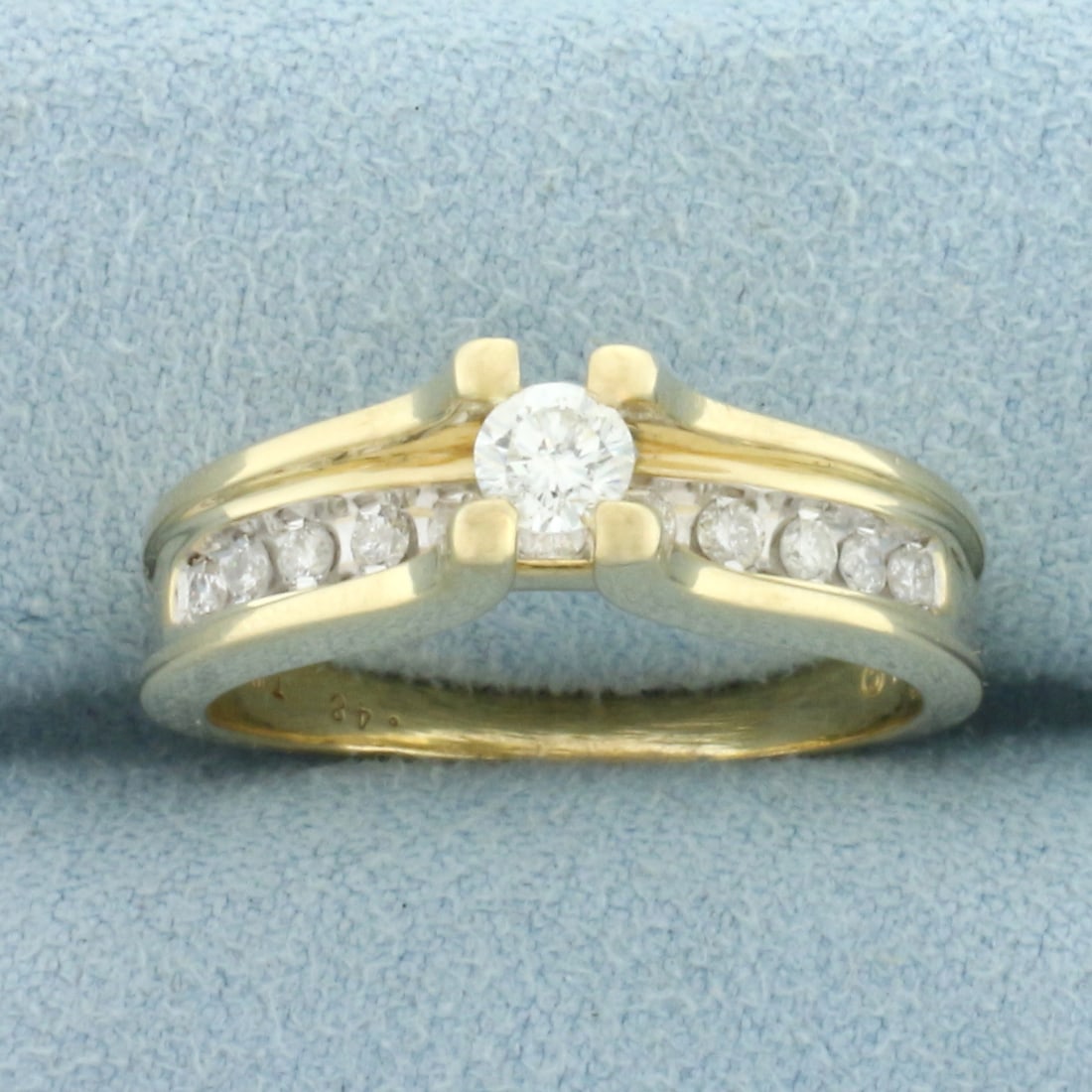 Cathedral Diamond Engagement Ring in 14k Yellow Gold: In 14k Yellow Gold. Contains one high quality .22ct round brilliant diamond, H color/I clarity, eye clean, great cut for added brilliance. Also contains 11 diamonds in shank, .26ct TW, of similar high