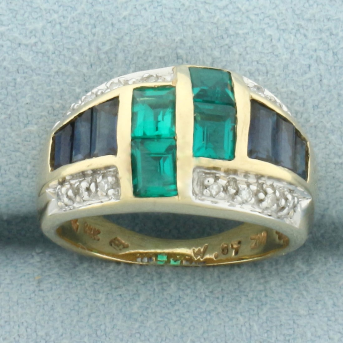 Sapphire, Tourmaline, and Diamond Ring in 14k Yellow Gold: In 14k Yellow Gold. Contains four 4mm high quality natural Tourmaline gemstones with intense emerald green color and excellent clarity. Also contains two 4.3mm, two 3.5mm, and two 3mm high quality nat