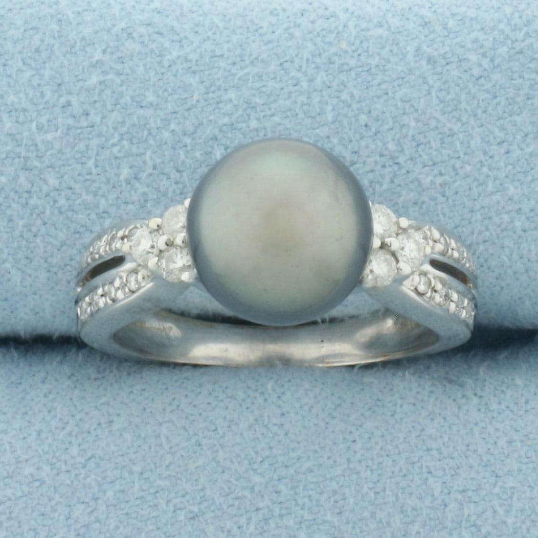 Tahitian Pearl and Diamond Ring in 14k White Gold: In 14k White Gold. Contains one 9.5mm high quality Cultured Tahitian Pearl with high luster. Also contains twenty-two high quality .01ct diamonds, VS clarity/G color. Size 7. 5.3g.