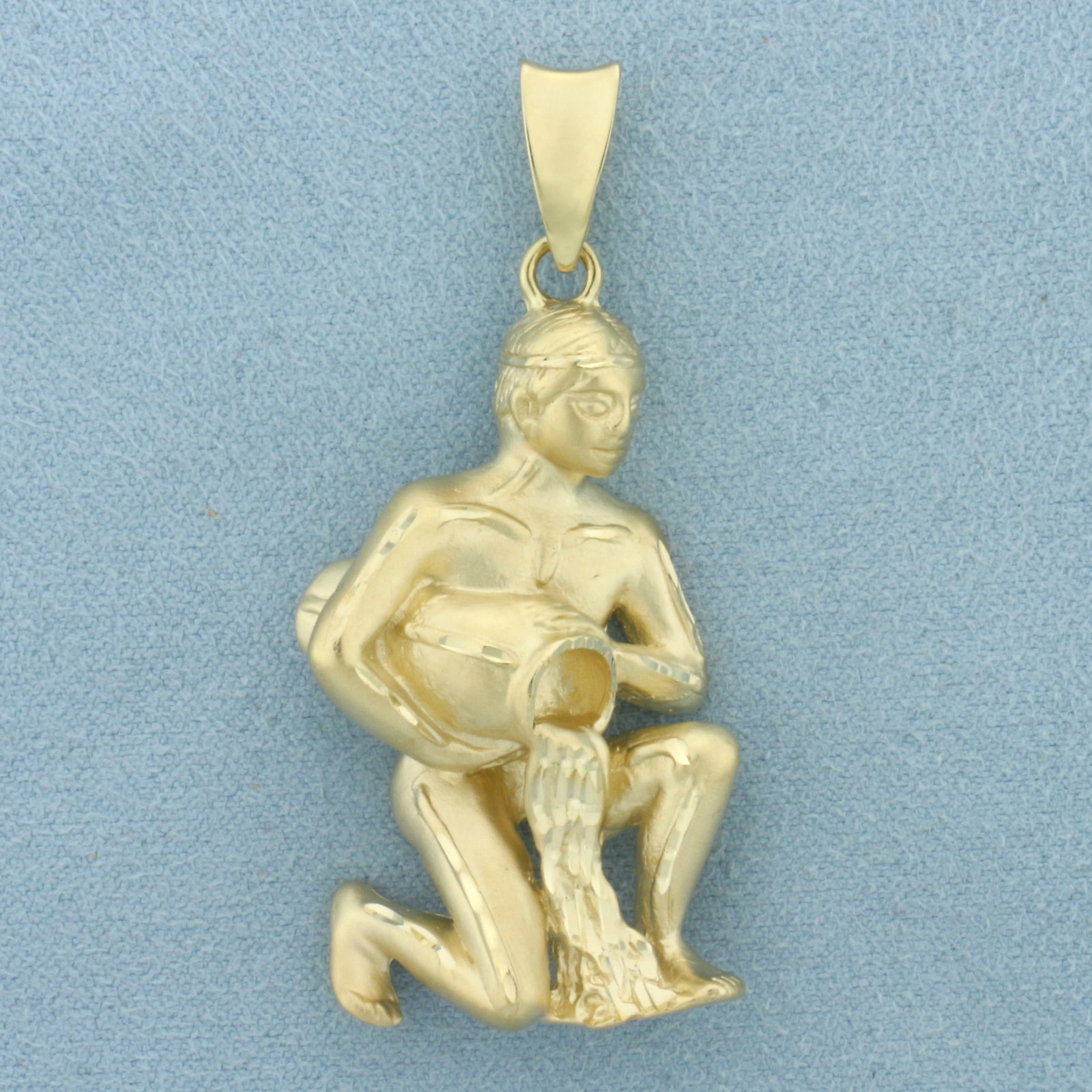 Aquarius Zodiac Water Bearer Pendant in 14k Yellow Gold: In 14k Yellow Gold. 2 inches long (including bale). 7/8 inch wide at widest. 15.3g.