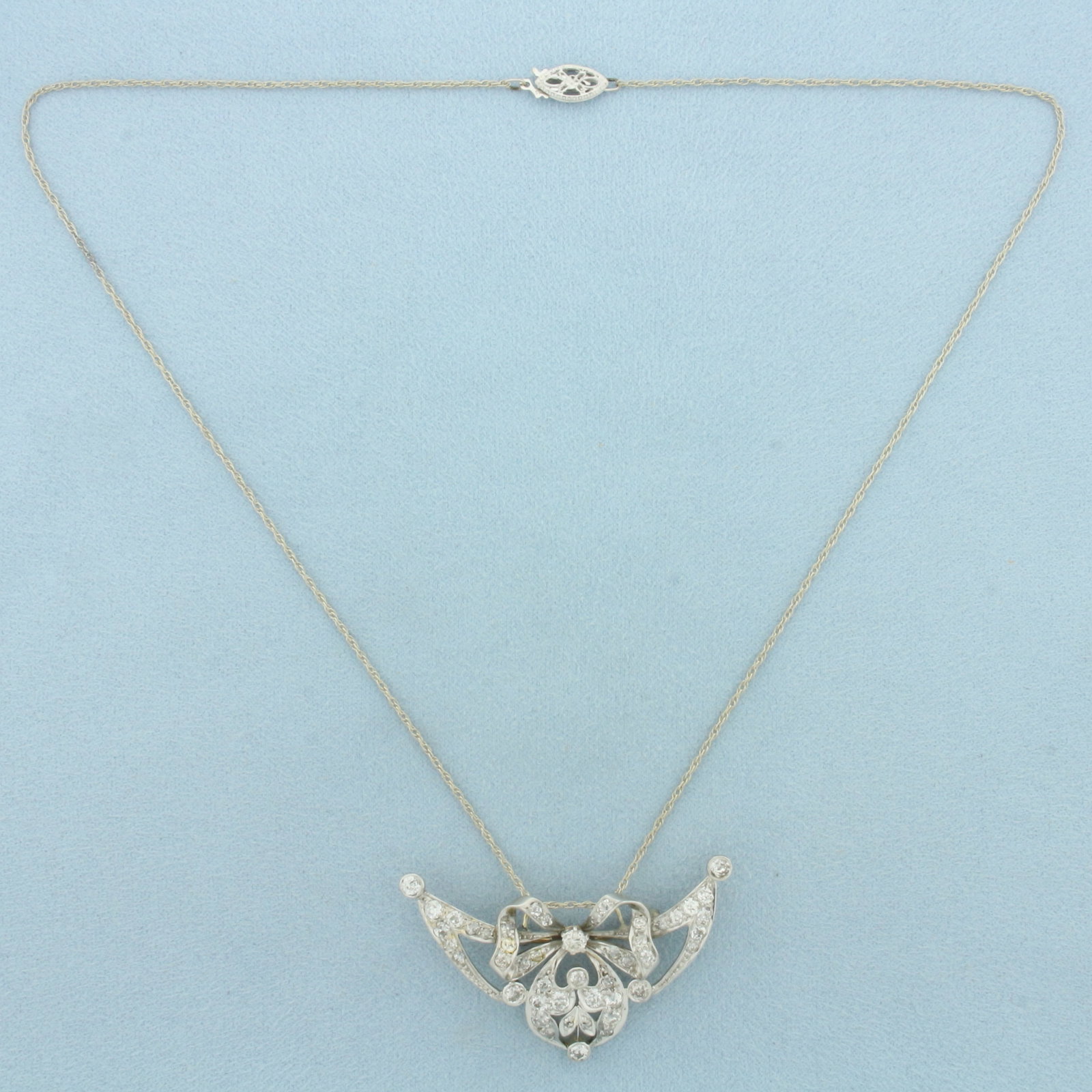 Antique Old European Cut Diamond Necklace or Brooch in 14k White Gold: In 14k White Gold. Contains approximately 1ct TW of high quality Old European Cut diamonds, VS to SI clarity/H to I color. 17 1/2 inch long chain. Pendant/brooch is 1 7/8 inch by 1 1/8 inch. Pendant c