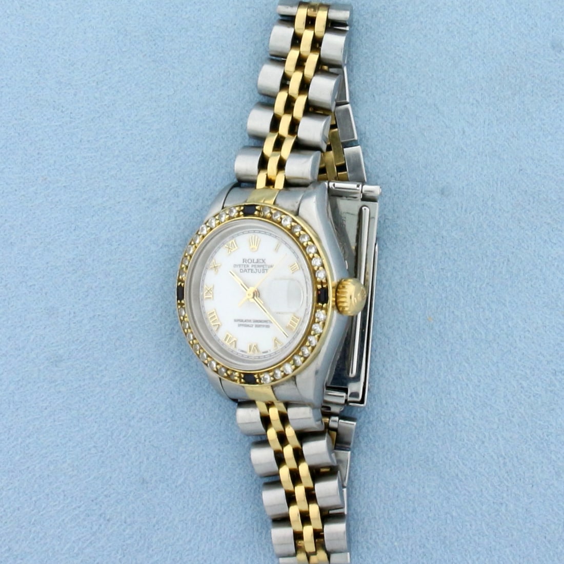 Ladies Rolex Datejust Watch Two Tone Model 69173: 18k Gold and Stainless Steel. Overall great condition, some stretch on band as expected, no scratching on crystal. 26mm case. White roman dial, diamond and sapphire bezel. Movement runs great, keeps t