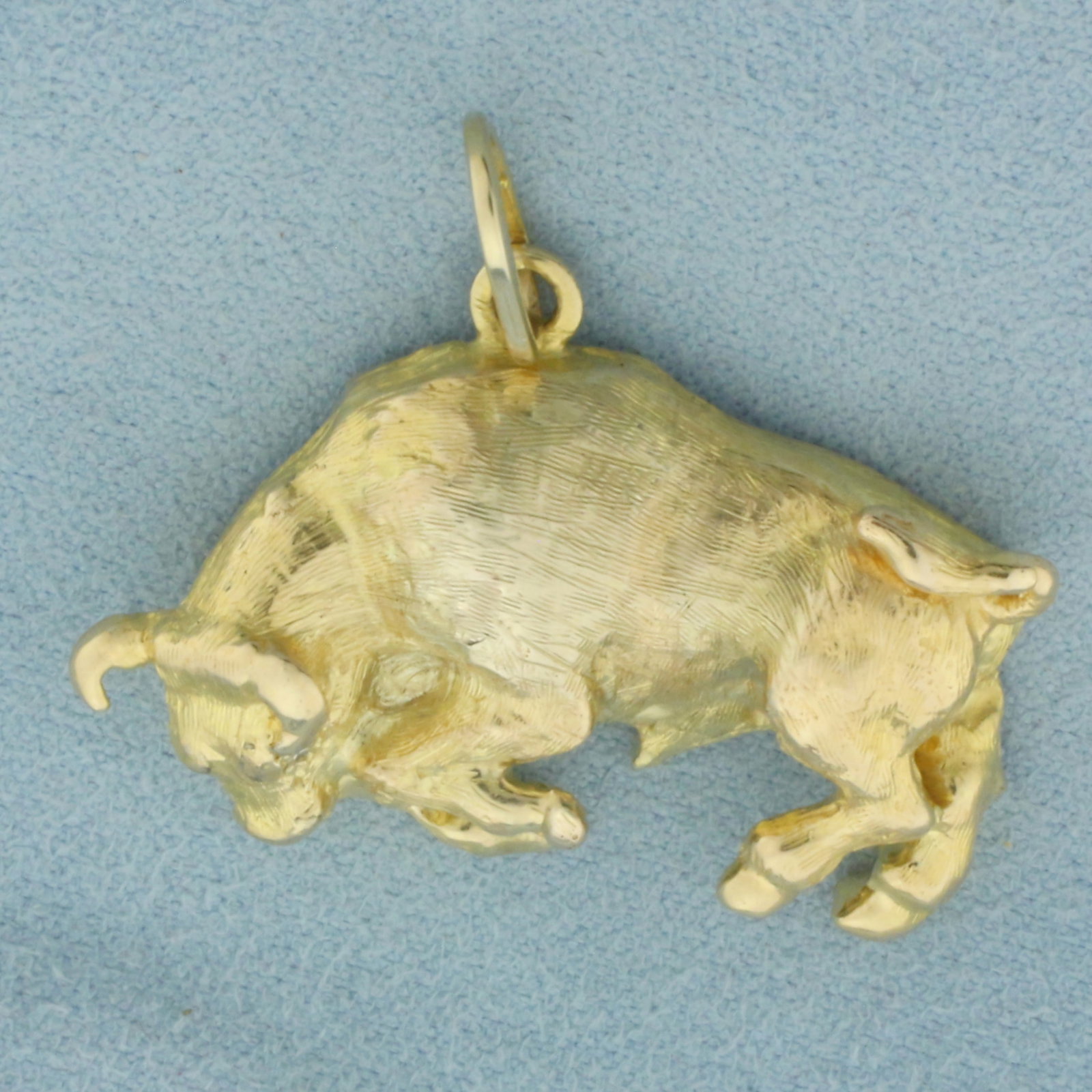 Mens Diamond Bull Pendant in 14K Yellow Gold: In 14k yellow gold. Measures 1.25 inches high (including bail) by 1.5 inches wide. Contains two high quality .01ct diamonds as eyes. Solid gold, not hollow. 22.2g