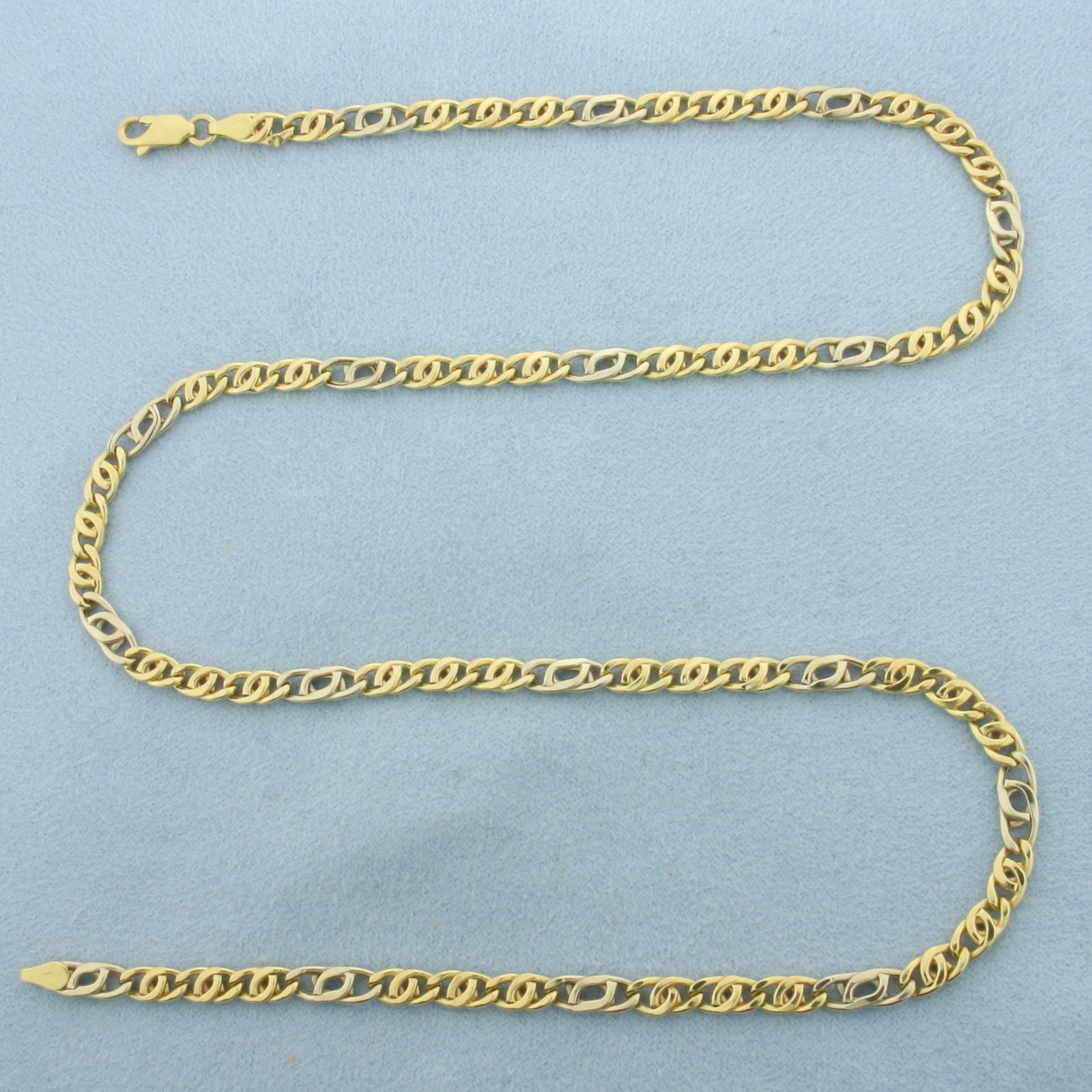 20 Inch Two-Tone Anchor Mariner Link Chain Necklace in 18k Yellow and White Gold: In 18k Yellow and White Gold. 20 inches long. 4mm wide. Lobster clasp. 10.1g.