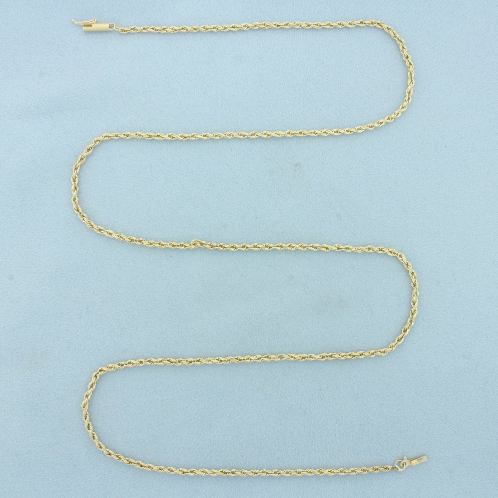 26 Inch Rope Link Chain Necklace in 14k Yellow Gold: In 14k Yellow Gold. 26 inches long. 2.4mm wide. Barrel clasp with safety latch. 4.0g.