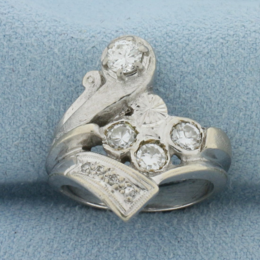 Designer Abstract Design Diamond Ring in 14k White Gold: In 14k white gold. Contains one 1/4ct, three 0.15ct, and four 0.01ct high quality diamonds, SI clarity/H color. Size 5 1/2. 8.2g.