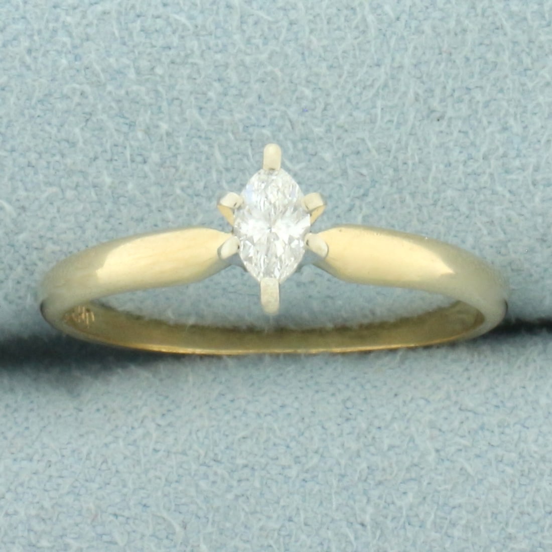 Marquise Diamond Solitaire Ring in 14k Yellow Gold: In 14k yellow gold. Contains one high quality 1/4ct Marquise diamond, VS clarity/H color. Band is 1.6mm wide. Size: 8.