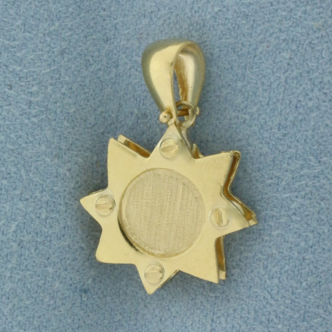 Designer Star Pendant in 18k Yellow Gold: In 18k Yellow Gold. 7/8 inch long. 5/8 inch wide. 3.6g.