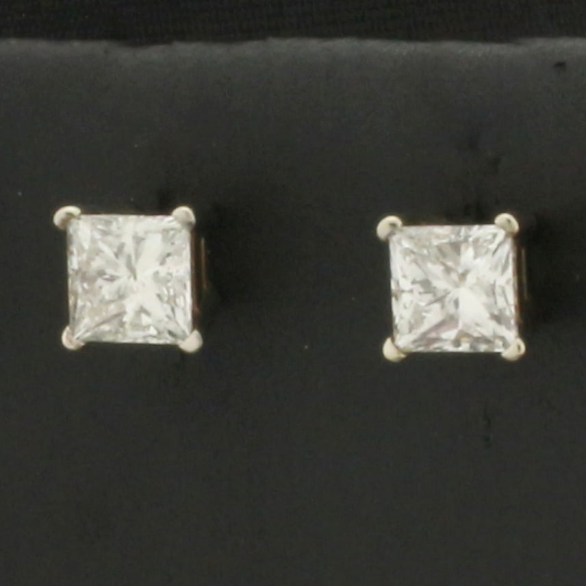 Natural Princess Cut Diamond Stud Earrings in 14k White Gold: In 14k White Gold. Contains two 4.25mm high quality natural princess diamonds, 1ct TW, SI2 clarity/H color, eye clean, great cut for added brilliance. Basket setting. Friction backs.