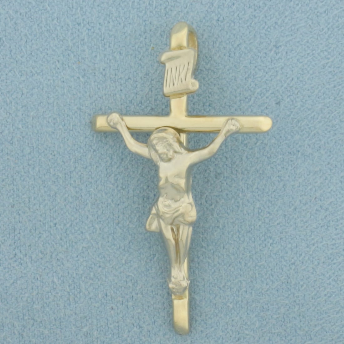 Crucifix Cross Pendant in 14k Yellow and White Gold: In 14k Yellow and White Gold. 1 1/2 inch long. 7/8 inch wide. 2.5g.