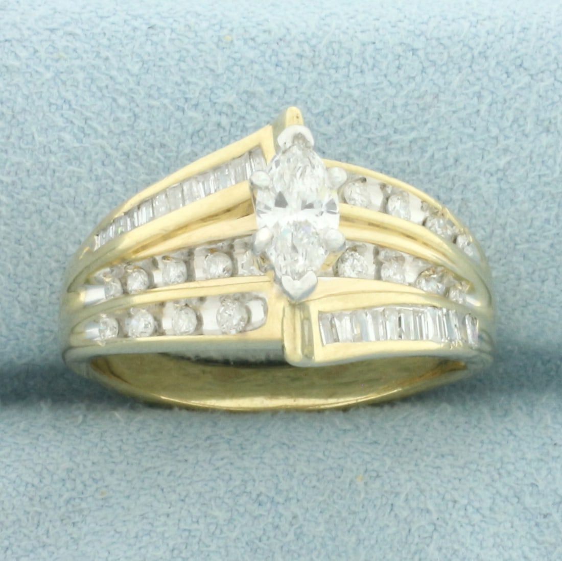 Marquise Diamond Engagement Ring in 14k Yellow Gold: In _k Yellow Gold. Contains one 8mmx4mm high quality marquise diamond, approximately 1/2ct, SI clarity/G color, eye clean, great cut for added brilliance. Also contains eighteen round and twenty three