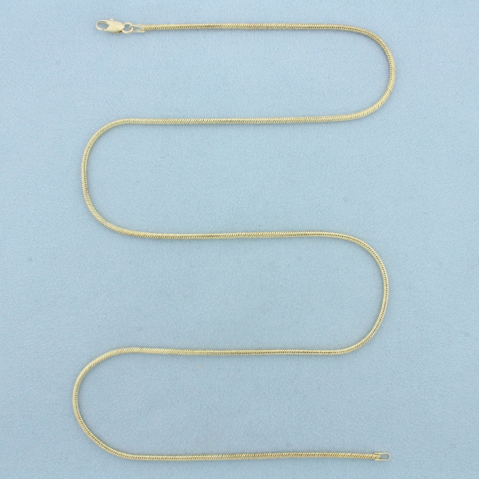 24 Inch Italian Snake Link Necklace in Gold Plated Sterling Silver: Gold plated sterling silver. 24 inches long. 2mm wide. Italian made. Lobster clasp. 14.4g.