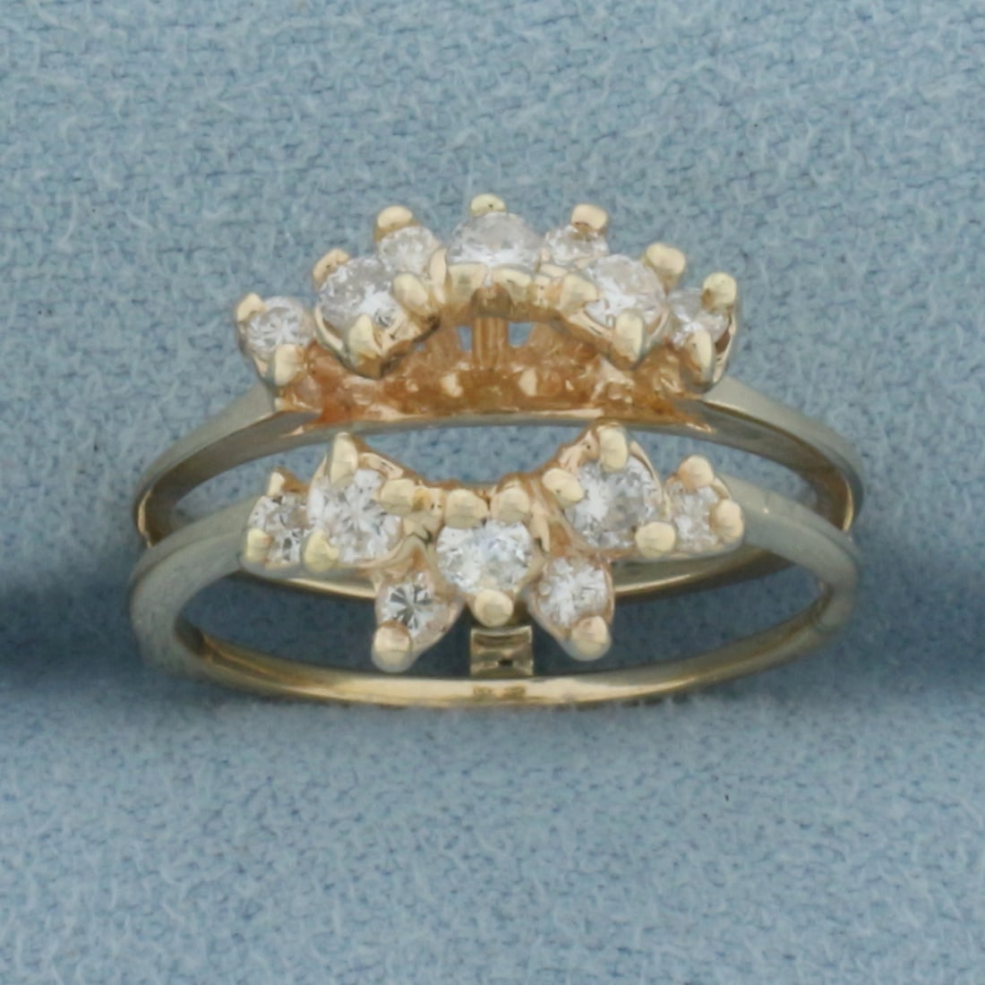 Diamond Enhancer Jacket Ring in 14k Yellow Gold: In 14k yellow gold. 12mm wide at top of ring. 5mm opening in the middle-top of ring. Contains fourteen high quality diamonds, 1/2ct TW, SI clarity/H color. Made to fit around round solitaire diamond e
