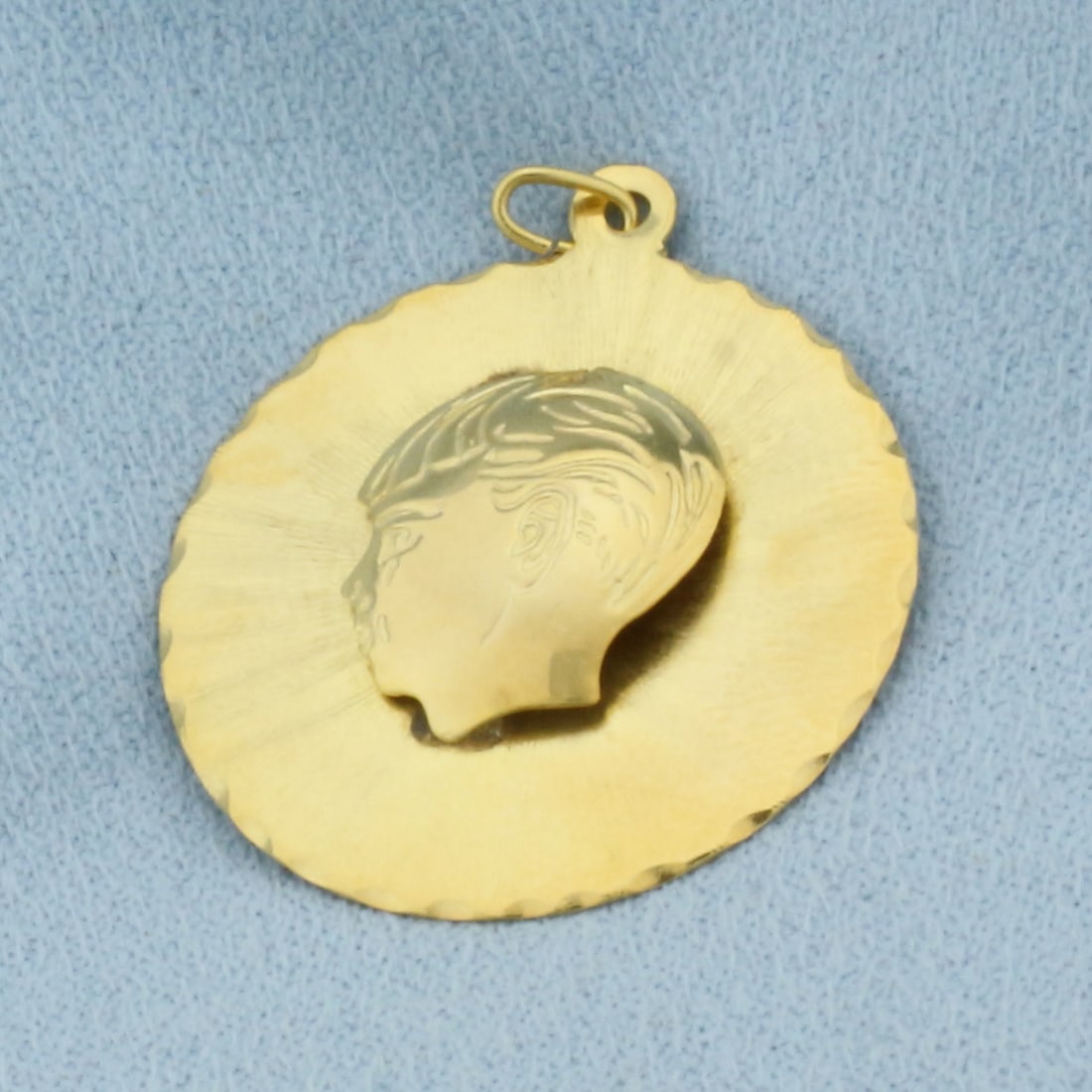 Boy Silhouette Engravable Charm or Pendant in 14k Yellow Gold: In 14k Yellow Gold. 1 1/8 inch long. 1 inch wide. Can inscribe name or date on back. 3.1g.