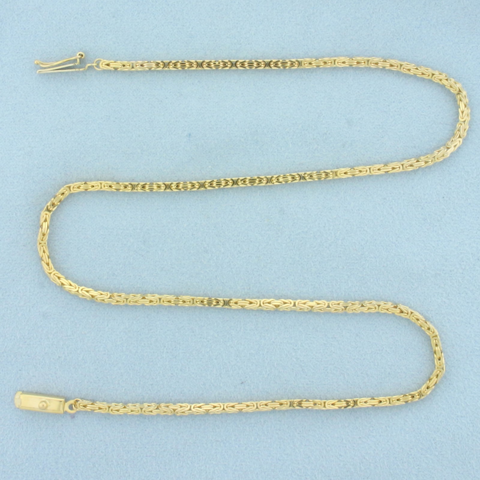 Italian Squared Byzantine Link Chain Necklace in 14k Yellow Gold: In 14k yellow gold. Italian made. 15 1/2 inches long and 2mm thick. Slide clasp with safety latch. 11.8g.