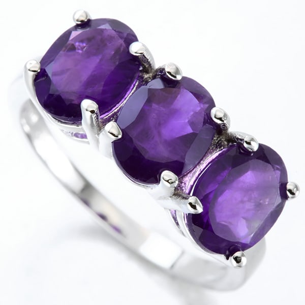 Amethyst 3-Stone Ring in Sterling Silver: In platinum over .925 sterling silver. Contains three oval cut amethyst gemstones, 3.3ctw. Size 7. 3.1g
