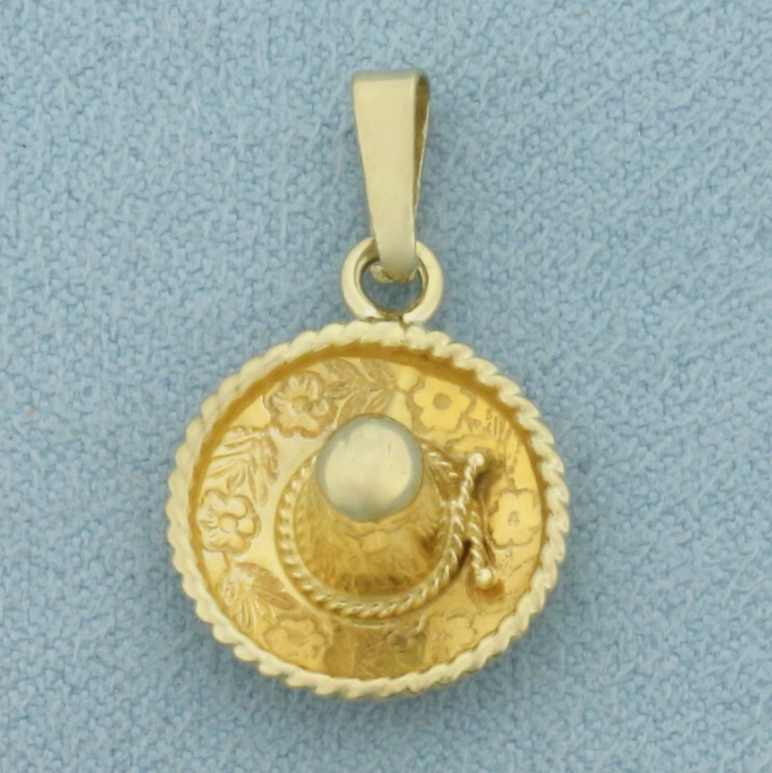 Sombrero Hat Pendant or Charm in 14k Yellow Gold: In 14k Yellow Gold. 1 inch long including bale. 1/2 inch wide. 1.5g.