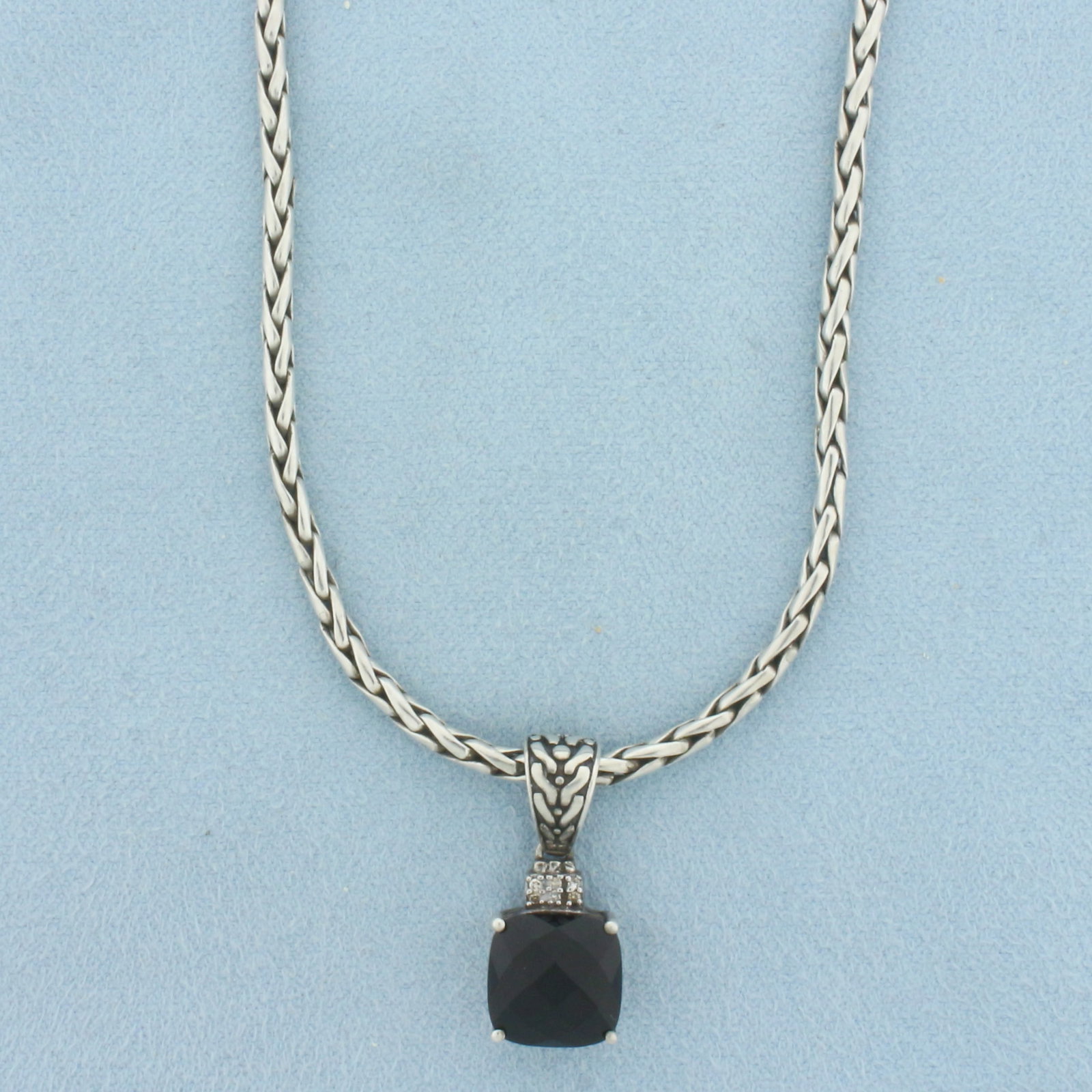Vintage Effy Garnet Pendant on Chain in Sterling Silver: Designer signed Effy. In .925 sterling silver. 18 inches long, 2.5mm wide foxtail chain with lobster clasp. Pendant is 7/8 inch long by 3/8 inch wide. Contains one 10mm high quality checkerboard cushi