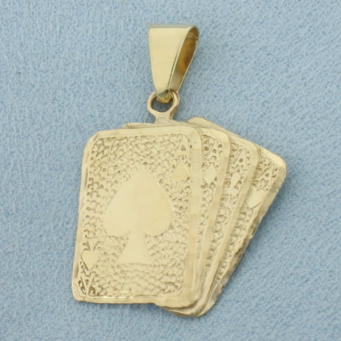 Four Aces Playing Cards Poker Pendant in 14k Yellow Gold: In 14k Yellow Gold. 1 1/4 inch long. 1 inch wide. 3.5g.