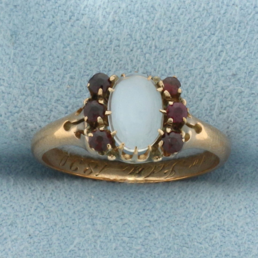 Antique 1890 Moonstone and Garnet Ring in 14k Rose Gold: In 14k rose gold. 8.6mm wide at top of ring. Antique hand engraving inside "Sam to Ida 1890". Contains 1 high quality oval cabochon Moonstone, 8x6mm. Also contains 6 high quality 2mm Old European cut