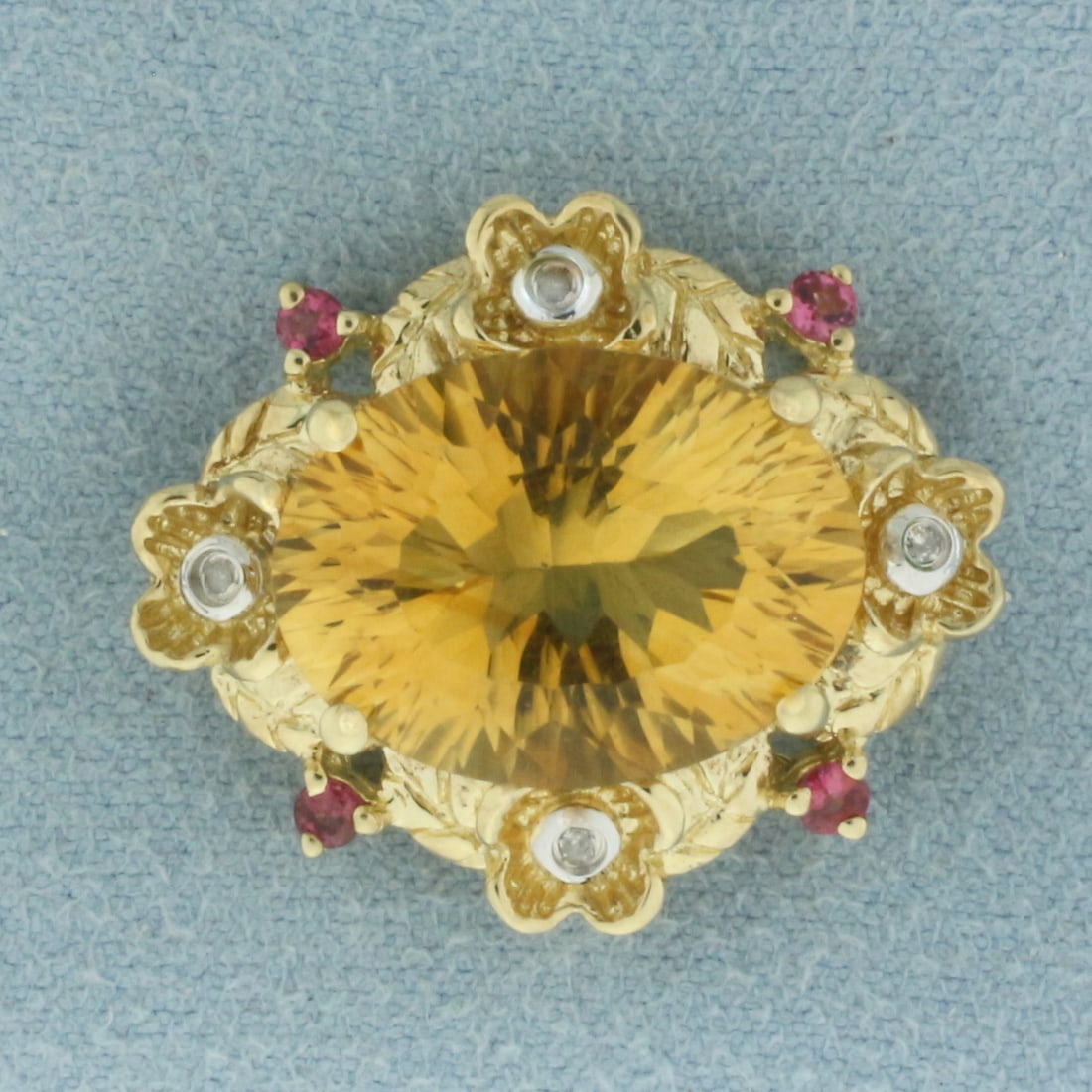 Citrine, Pink Tourmaline, and Diamond Pendant in 10k Yellow Gold: In 10k yellow gold. 7/8 inches long by 3/4 inches wide. Contains one 16x12mm high quality natural Citrine gemstone with vibrant color and excellent clarity. Also contains 4 high quality natural Pink