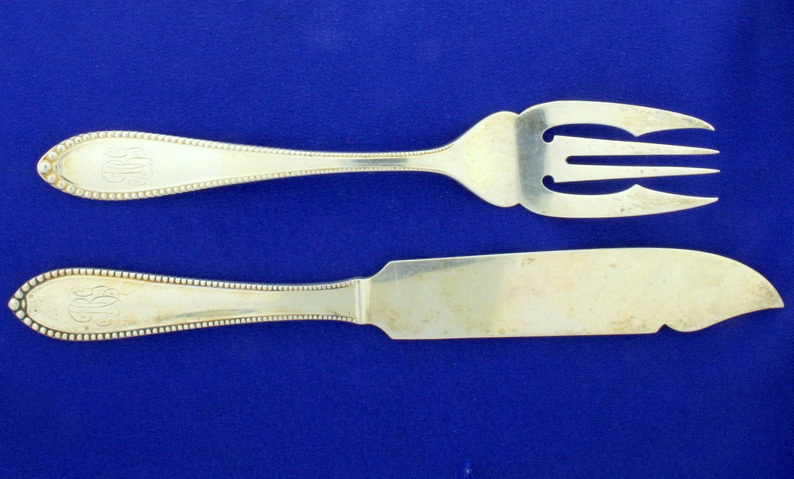 Antique Virginia by Gorham 21 Piece Fork and Knife Set from 1893 in Sterling Silver: Contains ten salad forks, 6 5/8 inch long. Also contains eleven knives 8" long each, flat handle, solid sterling silver. This set is engraved "1893" and stamped "sterling" with the old makers marks. T