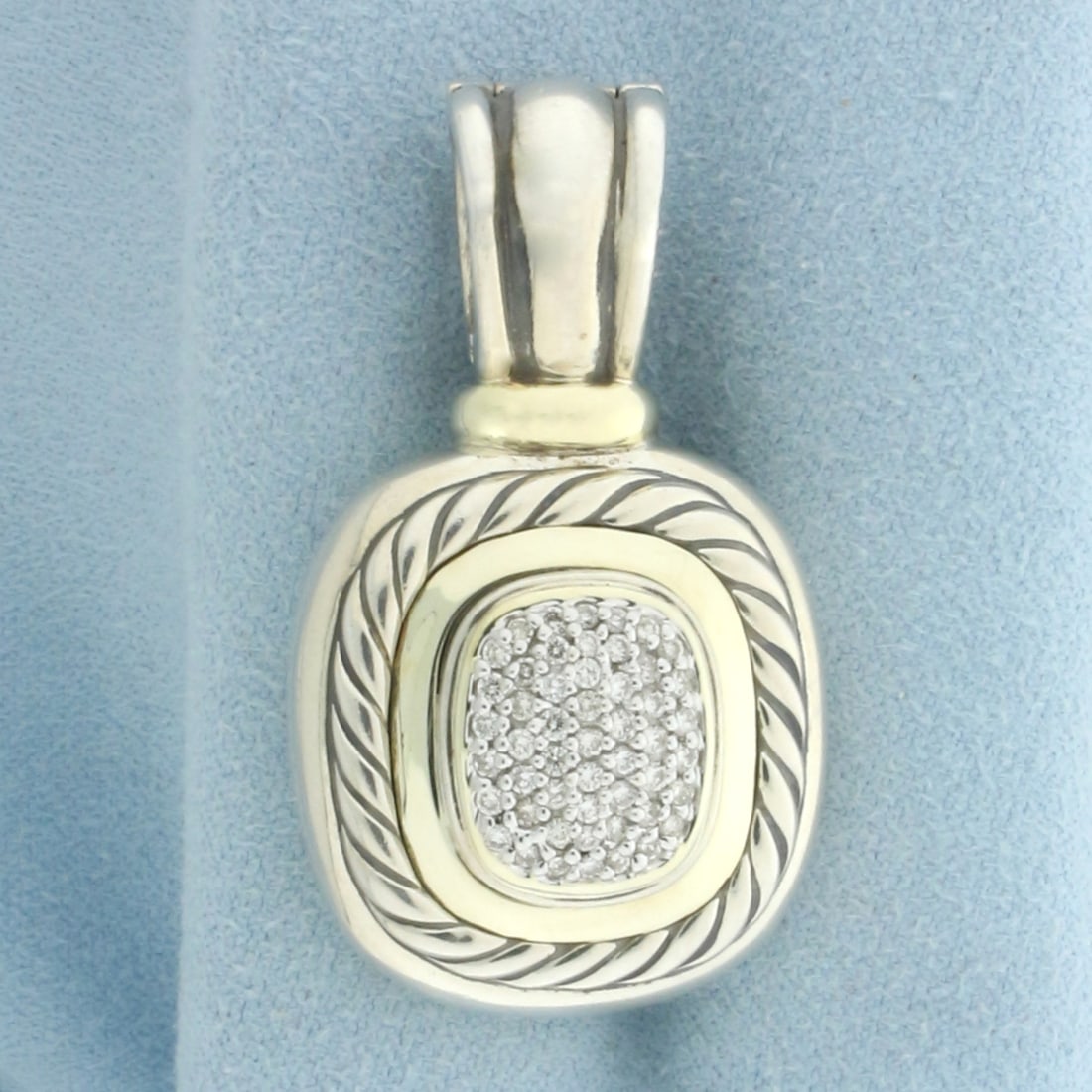 David Yurman Albion Diamond Pendant in 18K Yellow Gold and Sterling Silver: Designer signed David Yurman. In 18k yellow gold and .925 sterling silver. Contains fifty-three high quality .01ct diamonds. Measures 1 5/8 inches long by 7/8 inch wide. Hinged bail for easy on/off. 2
