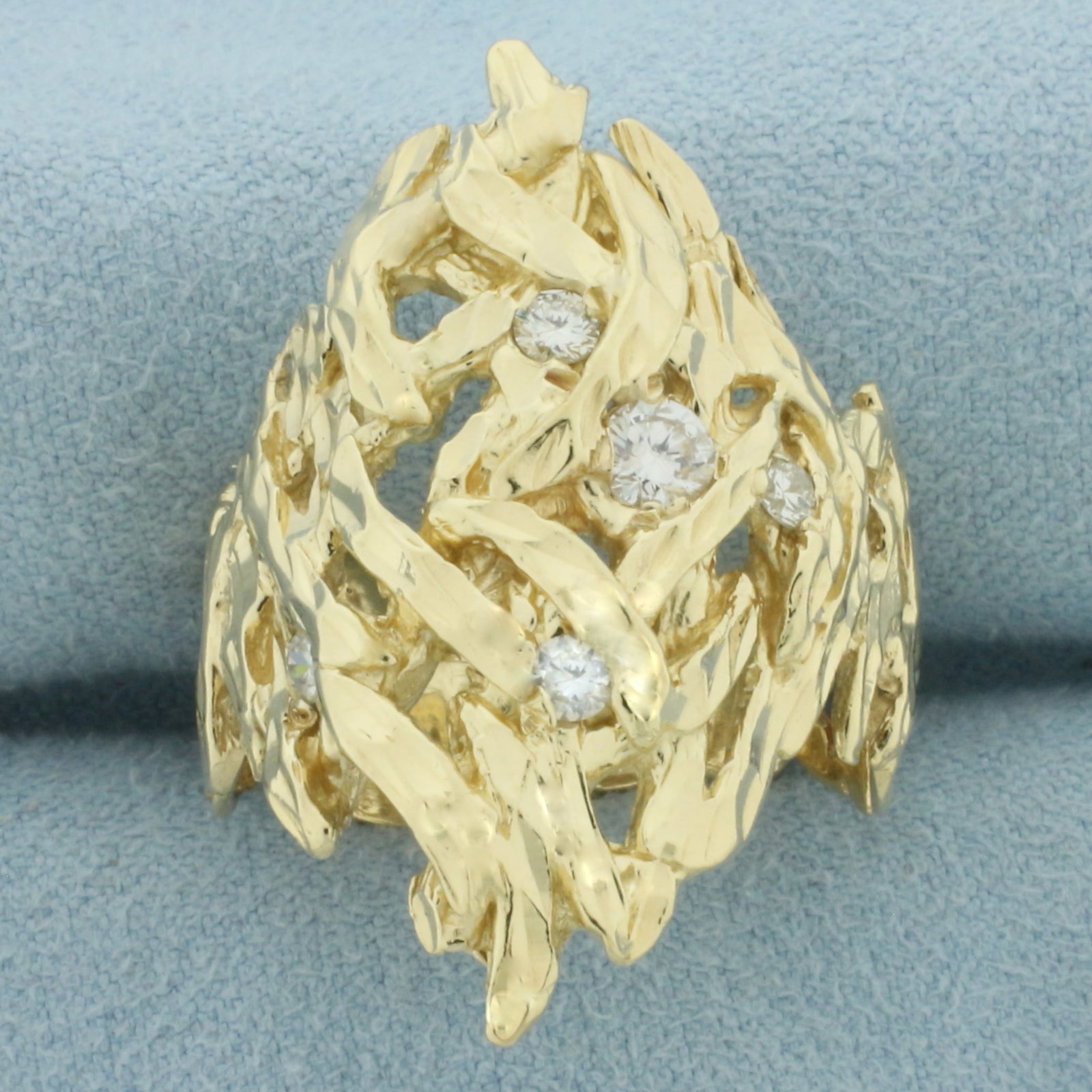Mens Diamond Cut Freeform Diamond Ring in 14k Yellow Gold: In 14k Yellow Gold. Contains one 1/4ct and four .05ct high quality natural diamonds, VS clarity/G color. 1 1/4 inch wide at top of ring. Size 11. 12.8g.
