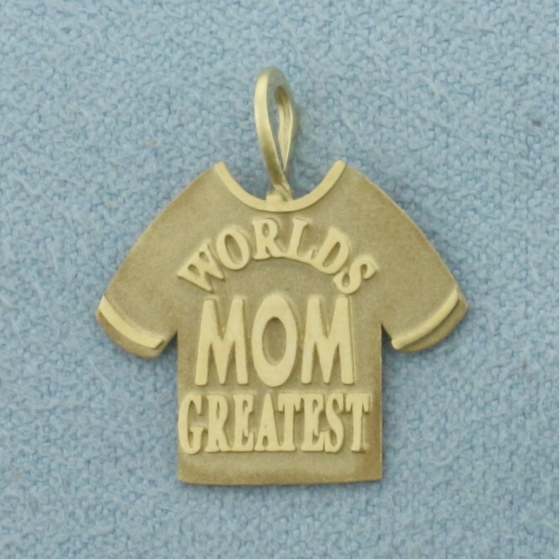 World's Greatest Mom Pendant in 14k Yellow Gold: In 14k Yellow Gold. 3/4 inch long (including bale). 3/4 inch wide. 1.2g.