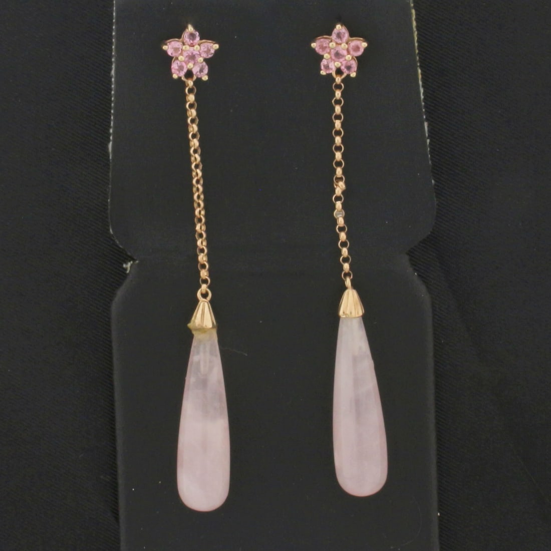 Rose Quartz and Pink Topaz Dangle Earrings in 10K Rose Gold: In 10k rose gold. 2.5 inches long. Contains 2 teardrop Pink Quartz gems, 25x7mm each. Also contains 12 Pink Topaz gems, 2mm each, 1/2ct TW, with intense color and excellent clarity. Friction backs. 5.