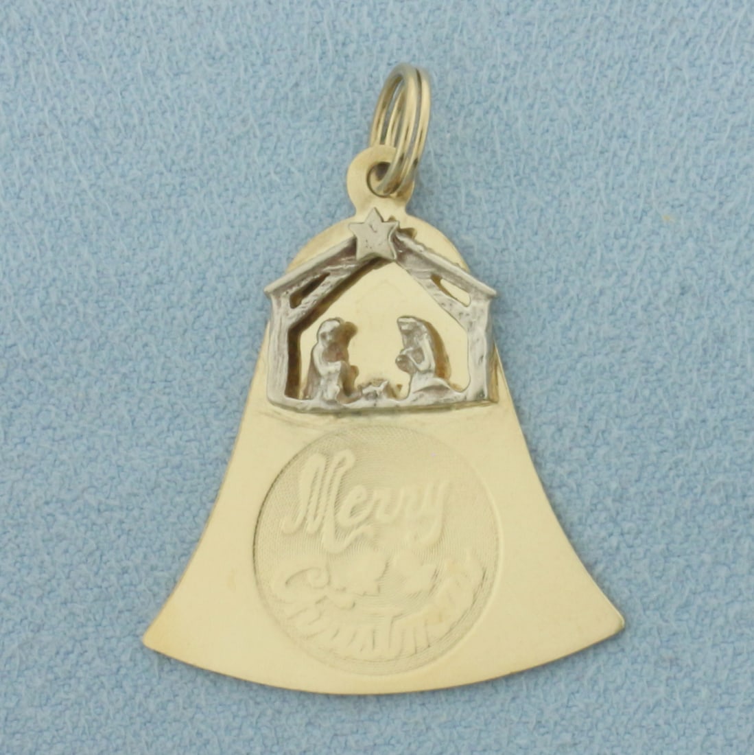 Merry Christmas Naivety Bell Charm in 14k Yellow and White Gold: In 14k Yellow and White Gold. 1 1/8 inch long. 1 inch wide. 2.7g.