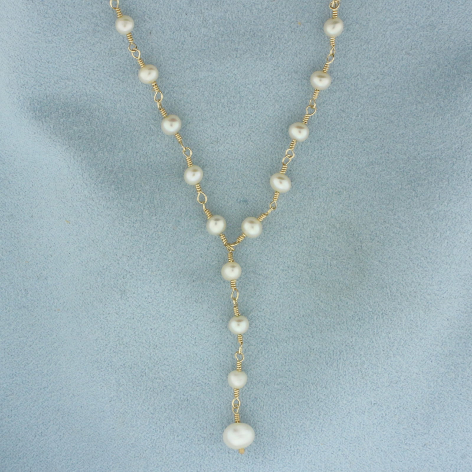 Cultured Pearl Y-Necklace in 14K Yellow Gold: In 14k yellow gold. 16 inches long. Contains one 3 6mm and forty one 3.8mm high quality cultured pearls with high luster. Lobster clasp. 5.7g.