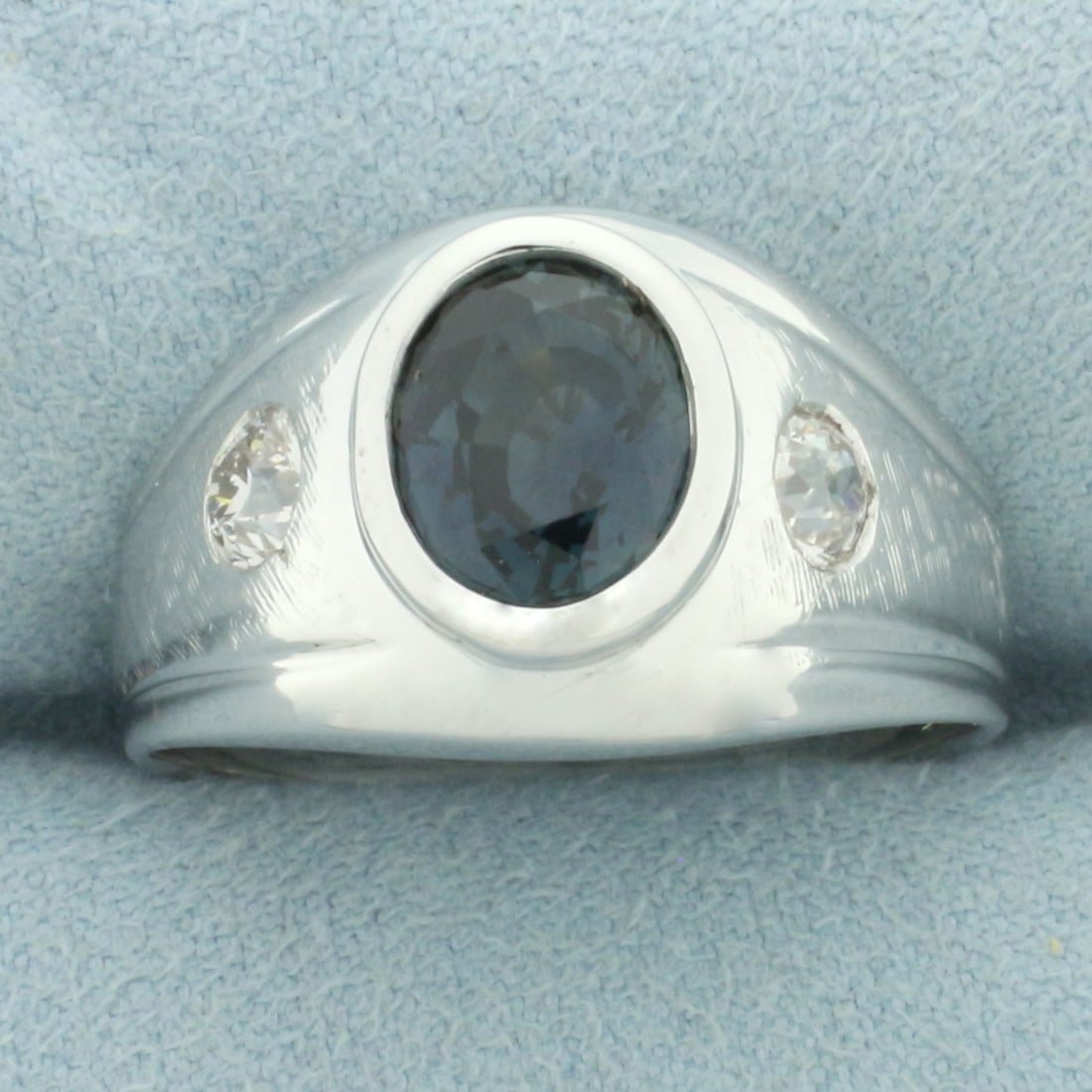 Mens Teal Sapphire and Old European Cut Diamond Ring in 14k White Gold: In 14k white gold. Contains one high quality natural 9mm by 7mm oval cut Sapphire gemstone, approximately 2.25ct, with intense teal color and excellent clarity. Also contains two 1/3ct Old European cu