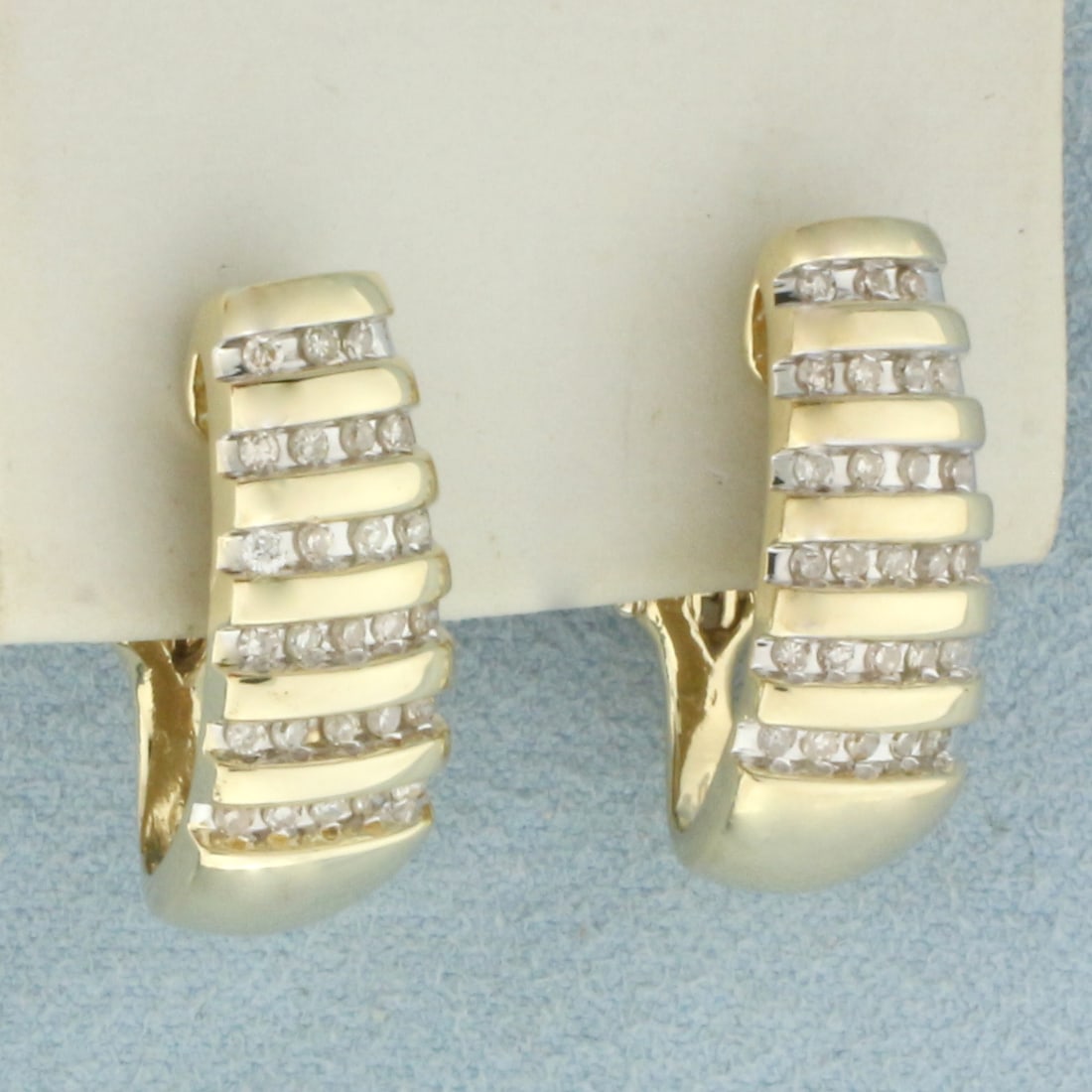 Diamond J-Hoop Earrings in 14k Yellow Gold: In 14k Yellow Gold. Contains fifty-two high quality diamonds, 1/2ct TW, SI clarity/H color. 3/4 inch long, 8.5mm wide at widest from front view. For Pierced Ears. Omega back. 8.4g.