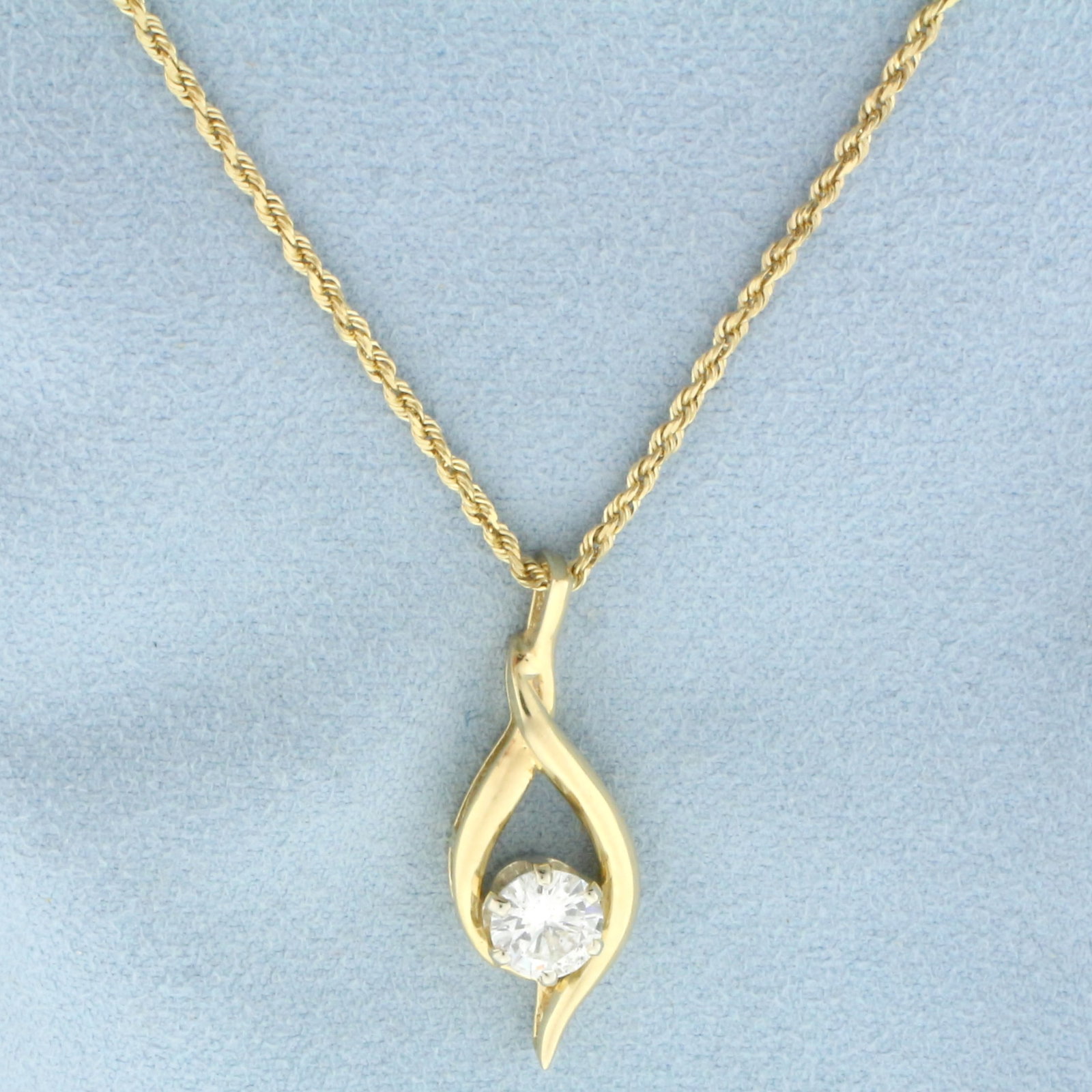 Designer Diamond Solitaire Necklace in 14k Yellow Gold: In 14k yellow gold. Contains one high quality 1ct Round Brilliant Diamond, SI2 clarity/F color, great cut for lots of sparkle, completely eye clean. Pendant is 1 1/4 inches long. Chain is 18 inches lo