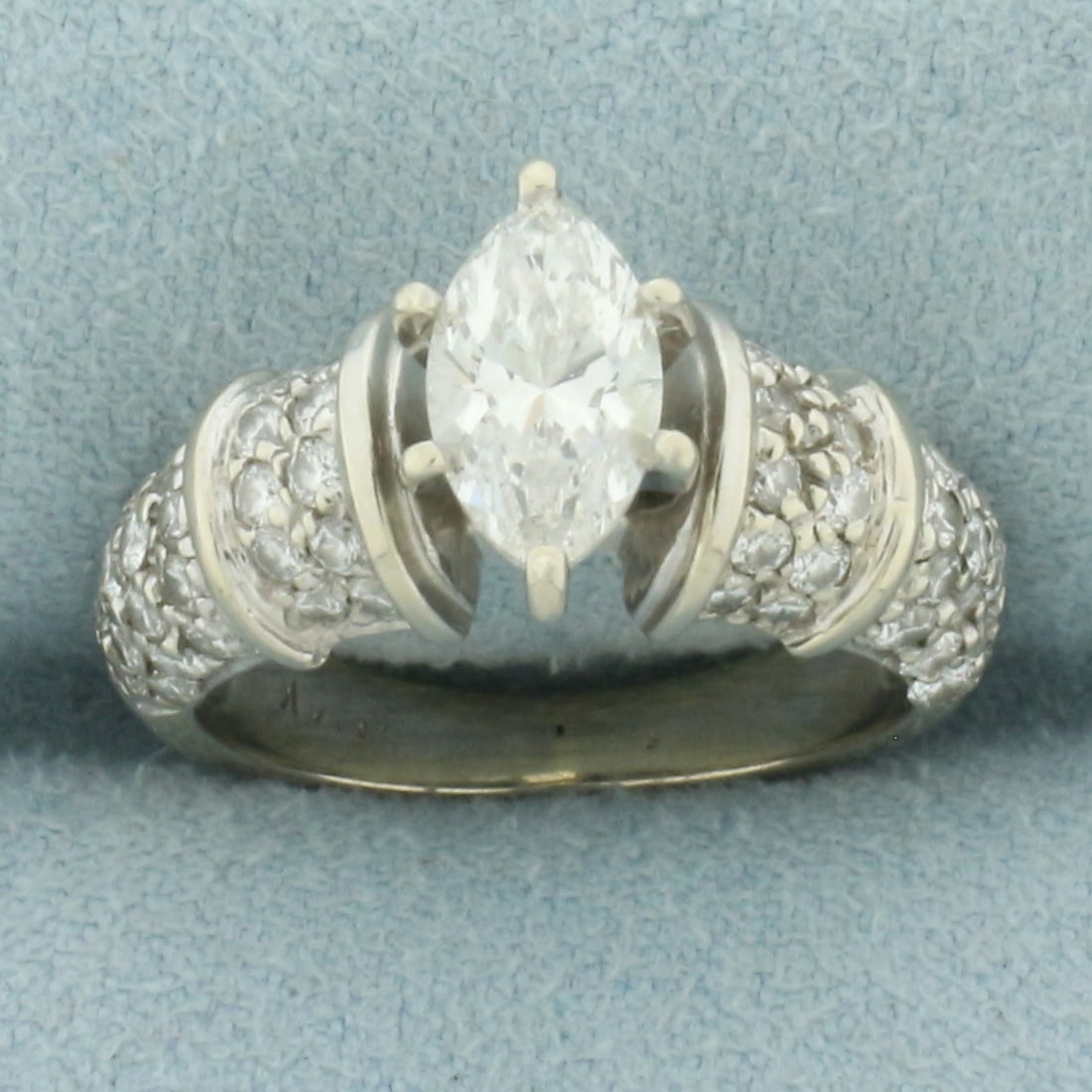 Vintage Marquise Diamond Engagement Ring in 14k White Gold: In 14k white gold. Contains one high quality 9.2mm by 5.1mm marquise cut diamond, 1.05ct, VS clarity/I color. Also contains sixty-two high quality round diamonds, 3/4ctw, of similar high quality. Size