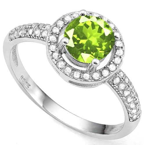 Peridot and White Sapphire Halo Ring in Sterling Silver: In platinum over .925 sterling silver. Contains one peridot gemstone, .88cts, with excellent color and clarity. Accented with .28ctw white sapphires. Size 8. 1.8g