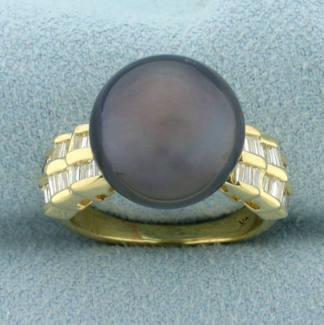 Tahitian Pearl and Diamond Ring in 14k Yellow Gold: In 14k yellow gold. Contains a 13mm high quality natural Tahitian Pearl with beautiful peacock color and high luster. Also contains 36 high quality .01ct baguette diamonds, VS clarity/G color. Size