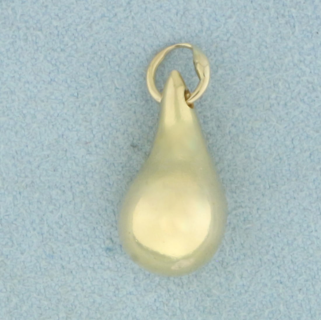 Teardrop 3D Charm or Pendant in 14k Yellow Gold: In 14k Yellow Gold. Solid gold, not hollow. 3/4 inch long including jump ring. 1/4 inch wide. 6.4g.