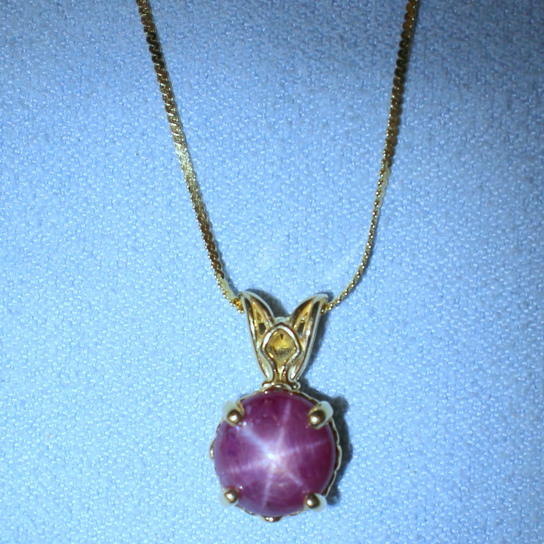 Natural Star Ruby Necklace in 14k Yellow Gold: In 14k Yellow Gold. Contains one 9.5mm high quality natural Star Ruby gemstone, approximately 5cts, with very distinctive "star" under light. Italian S-link chain is 20 inches long chain. 0.8mm wide. 