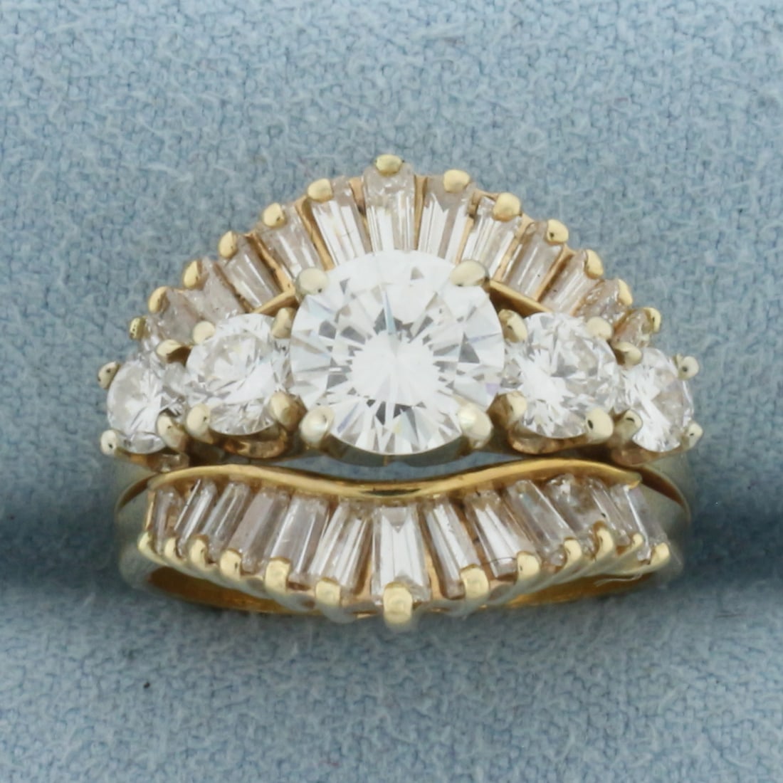 Vintage Round and Baguette Diamond Engagement Ring in 14k Yellow Gold: In 14k yellow gold. Center diamond is 1 ct high quality round brilliant cut, G color/VS clarity, excellent cut with lots of sparkle and brilliance. Also contains two 1/5 ct and two 1/8 ct high quality