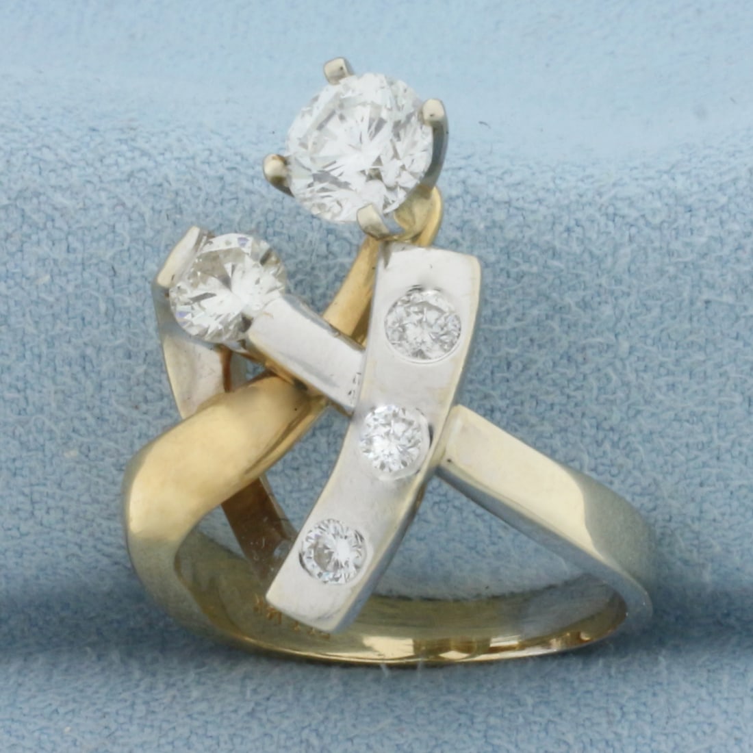 Designer Diamond Modern Abstract Ring in 14K Yellow and White Gold: In 14K Yellow and White Gold. Contains one high quality .9ct round brilliant Diamond SI clarity/H color. Also contains one high quality .4ct round cut Diamond, VS clarity/J color. Also contains one .1