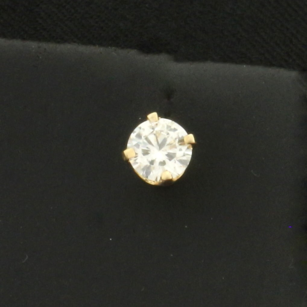 Single Diamond Screw Back Stud Earring in 14k Yellow Gold: In 14k yellow gold basket setting. Contains one high quality 1/3ct round brilliant diamond, SI clarity/H color. Screw backs. 5g.