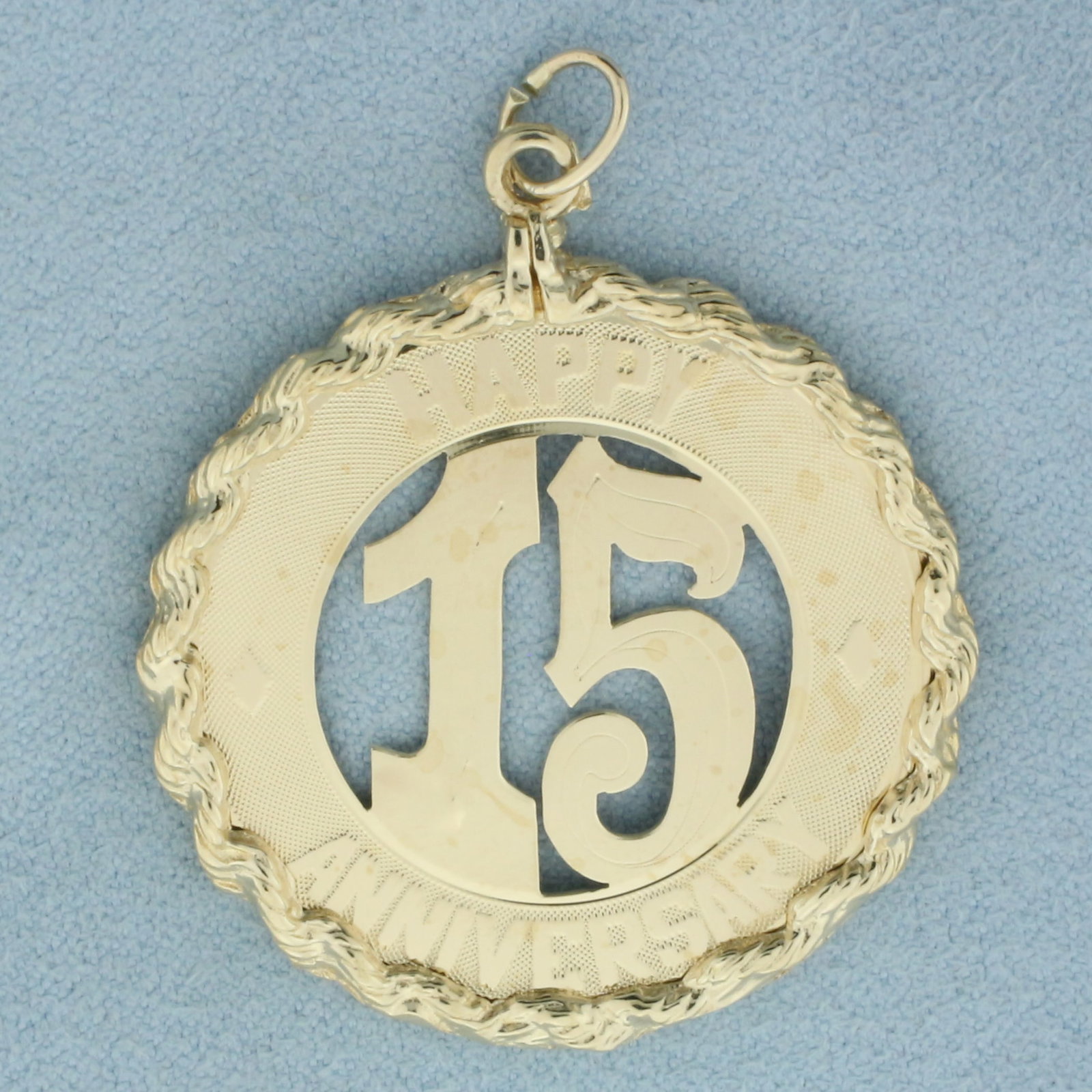 Happy 15 Year Anniversary Pendant or Charm in 14k Yellow Gold: In 14k yellow gold. 1.75 inches long (including jump ring) by 1 3/8 inch diameter. 8.2g.