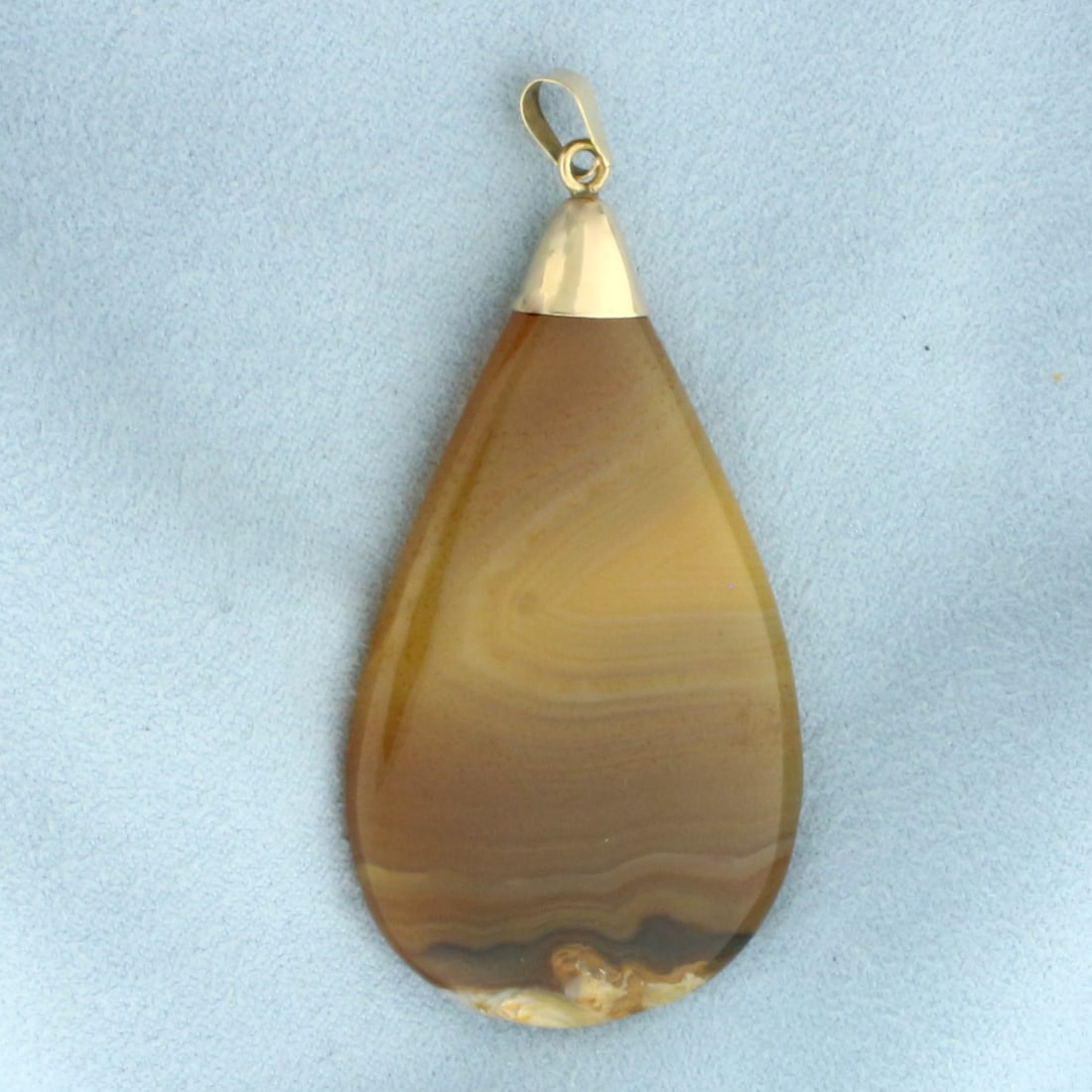 Large Agate Teardrop Pendant in 18k Yellow Gold: In 18k Yellow Gold. Contains one high quality polished agate with intense colors. 2 5/8 inch long. 1 3/8 inch wide. 19.9g.