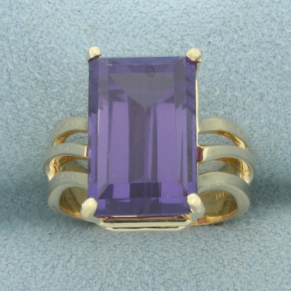 Purple Sapphire Solitaire Statement Ring in 14k Yellow Gold: In 14k Yellow Gold. Contains one 15.2x9.5mm high quality Sapphire gemstone, approximately 12cts, with vibrant color and excellent clarity. Size 5.5. 8.3g.