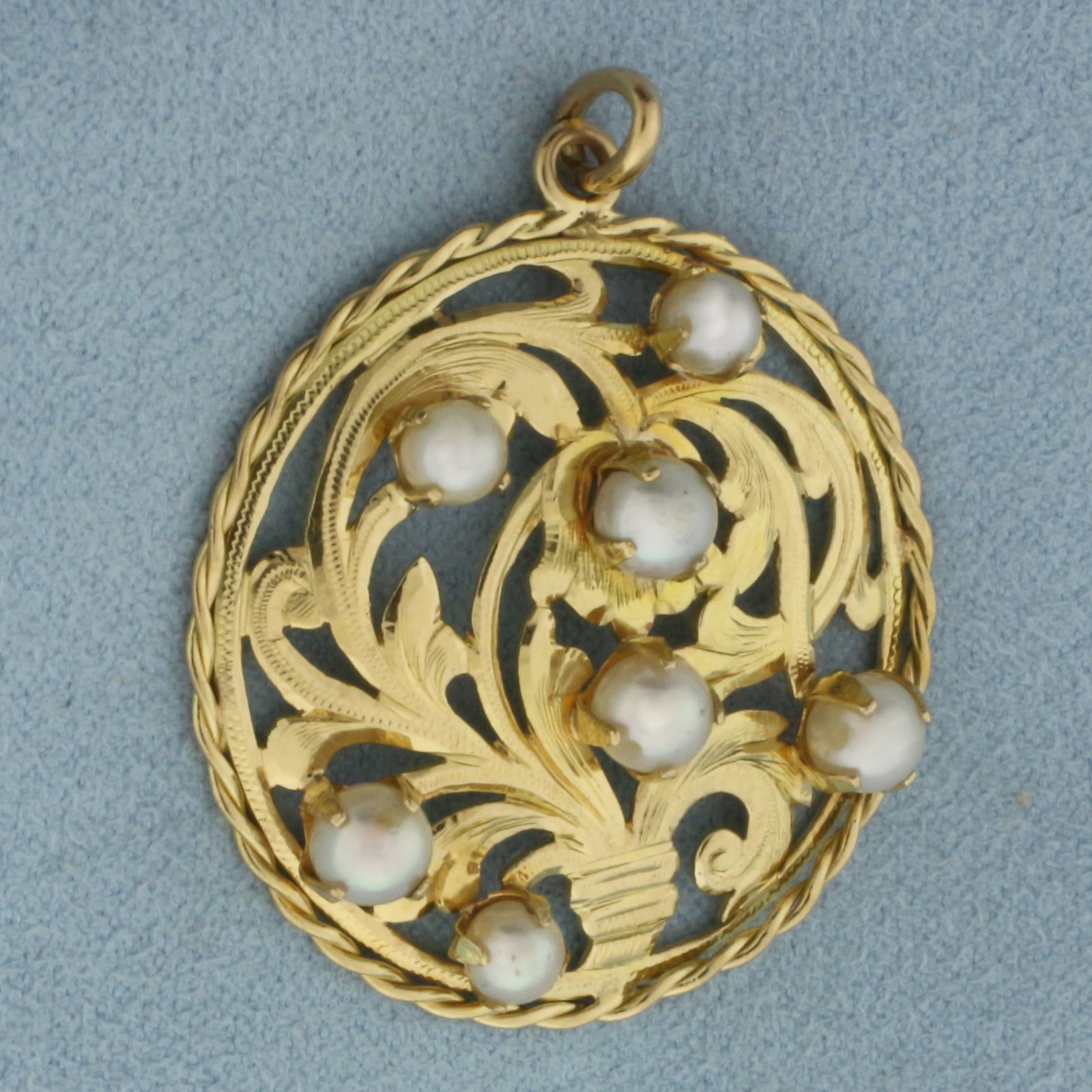 Vintage Pearl Scroll Design Pendant in 18K Yellow Gold: In 18k yellow gold. 1.25 inches diameter. Contains 7 high quality 4mm Cultured Pearls, with high luster.