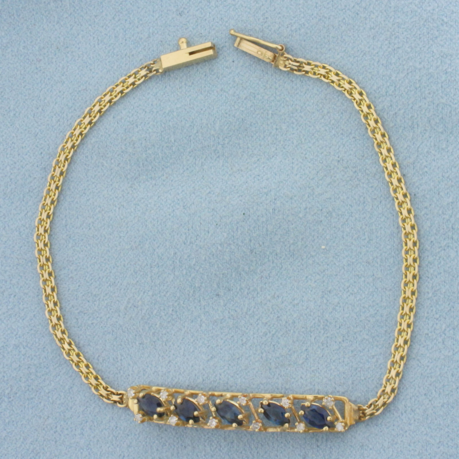 Vintage Sapphire and Diamond Bar Bracelet in 14K Yellow Gold: In 14K Yellow Gold. Contains five 5mm high quality natural marquise cut Sapphires with intense blue color and excellent clarity. Also contains twelve high quality .01ct diamonds, SI clarity/G color. 7