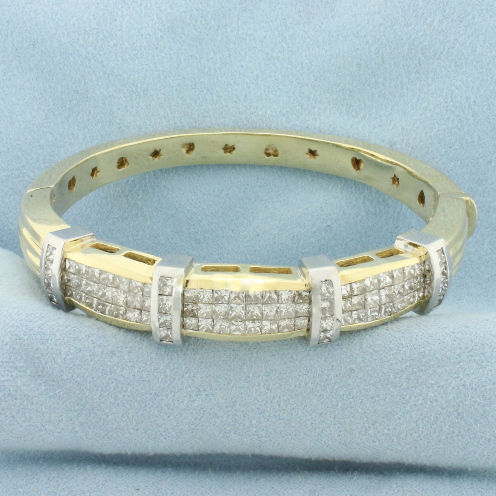 Invisible Set Diamond Hinged Bangle Bracelet in 14k Yellow and White Gold: In 14k Yellow and White Gold. Contains eighty-two high quality Princess diamonds, 6ct TW, SI clarity/H color. Interior dimensions: 2 1/4 x 2 1/8 inches. 11.5mm wide at widest. Stars and hearts design 