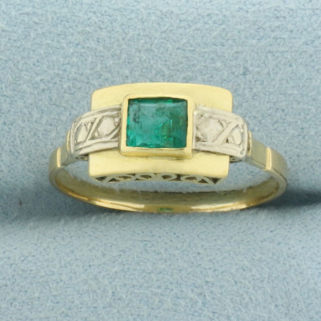 Vintage Emerald Ring in 14k Yellow and White Gold: In 14k Yellow and White Gold. Contains one 1/2ct high quality natural Emerald gemstone with vibrant color. 8mm wide at top of ring. Size 10. 3.8g.
